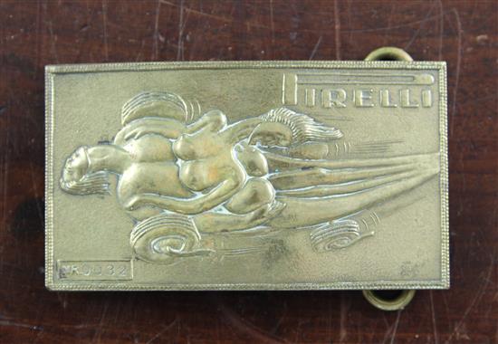 A Salvador Dali for Pirelli brass belt buckle, 4in., in original Deane & Adams box